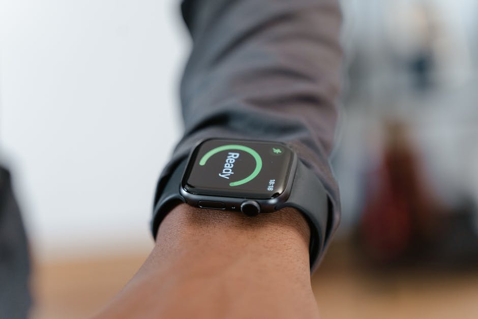 A modern smartwatch displays a 
