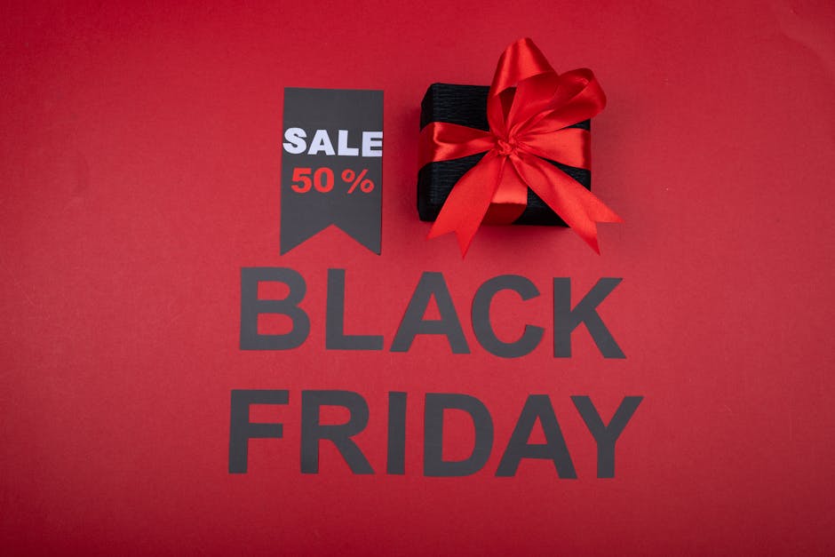 Celebrate Black Friday with a 50% off deal featuring a gift box and vibrant red theme.