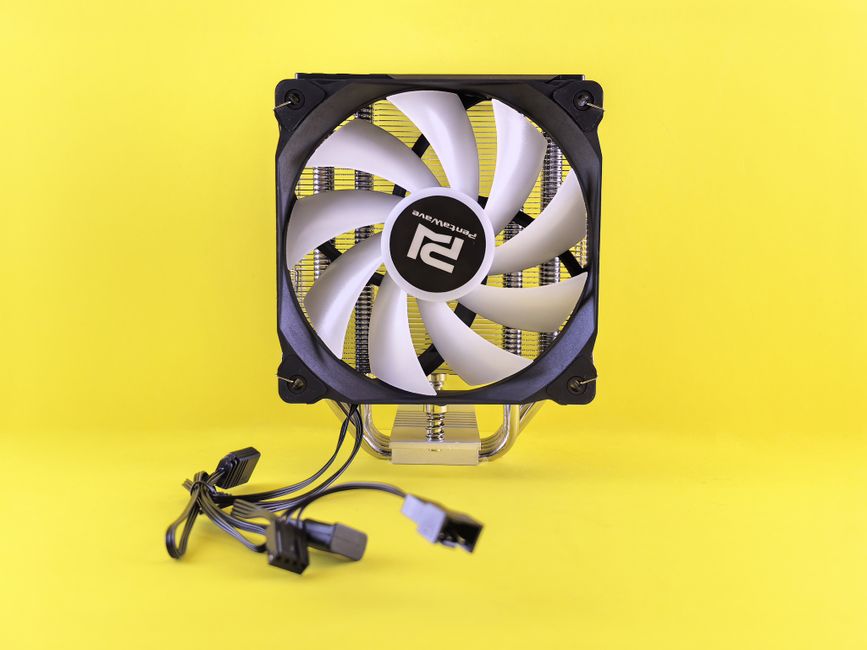 Close-up of a computer CPU cooler with fan on a vibrant yellow background for technology themes.