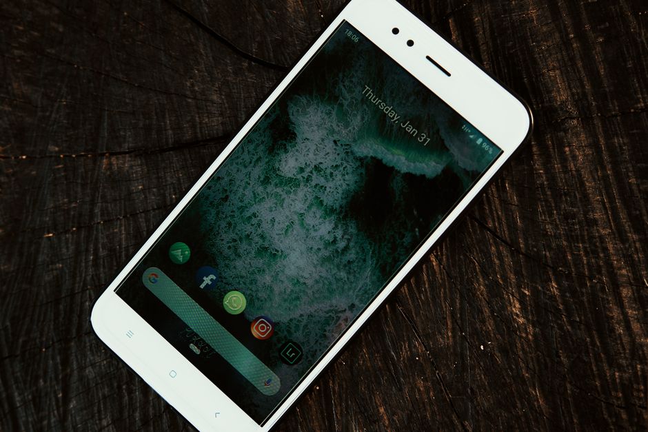 A close-up shot of a smartphone displaying social media app icons, showcasing modern connectivity.